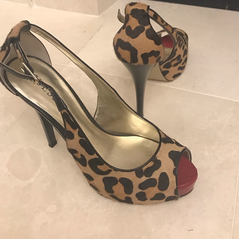 Guess multi colored leopard peep toe heels.